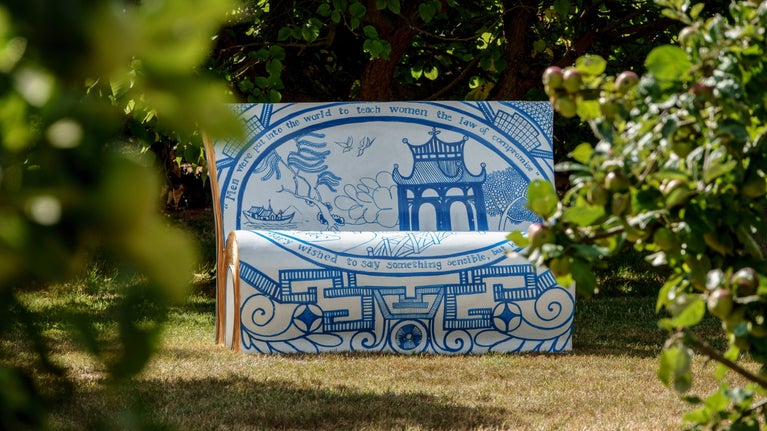 A bench in the shape of a book and specially decorated by an artist.